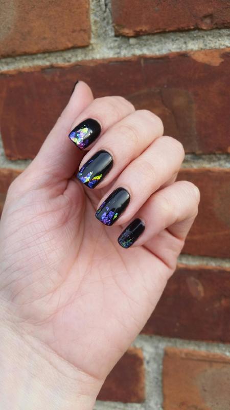 Gorgeous dark manicure with glitter accents